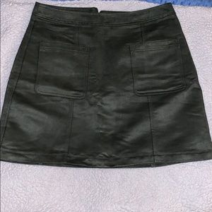 A suede green mini skirt.